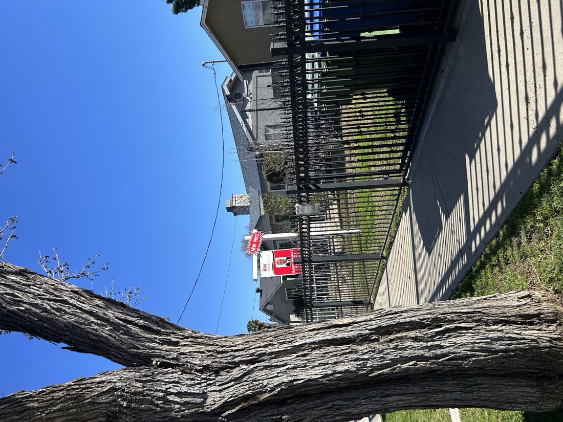 A Harry Shahbaz Keller Williams listing sign in front of a San Fernando Valley home